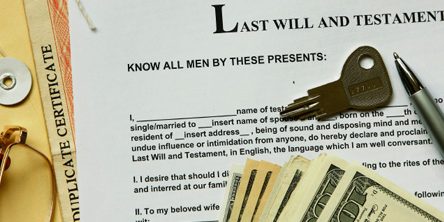 last will and testament with dollar , certificate and key.